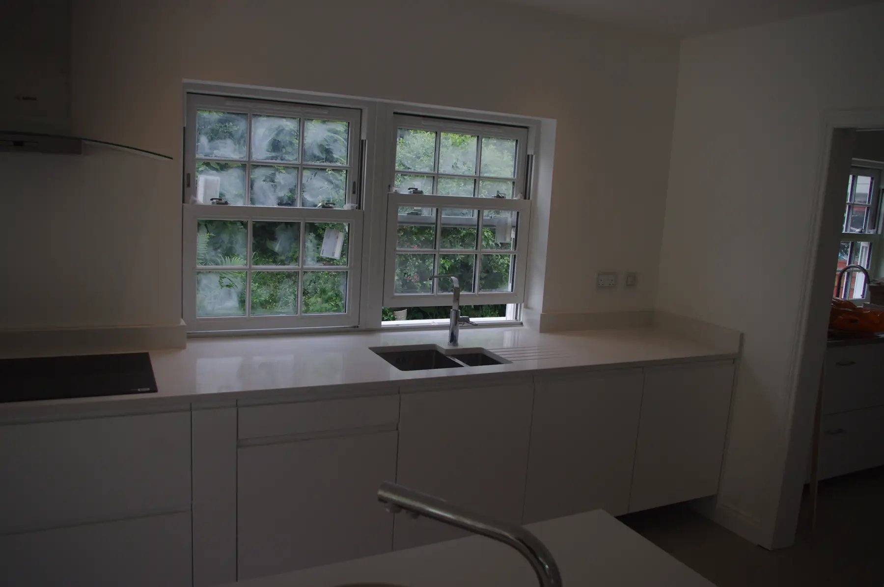 Kitchen units under the rear windows