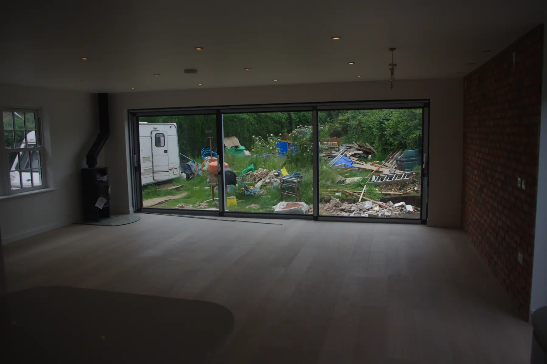 Large open-plan room with sliding doors to the garden