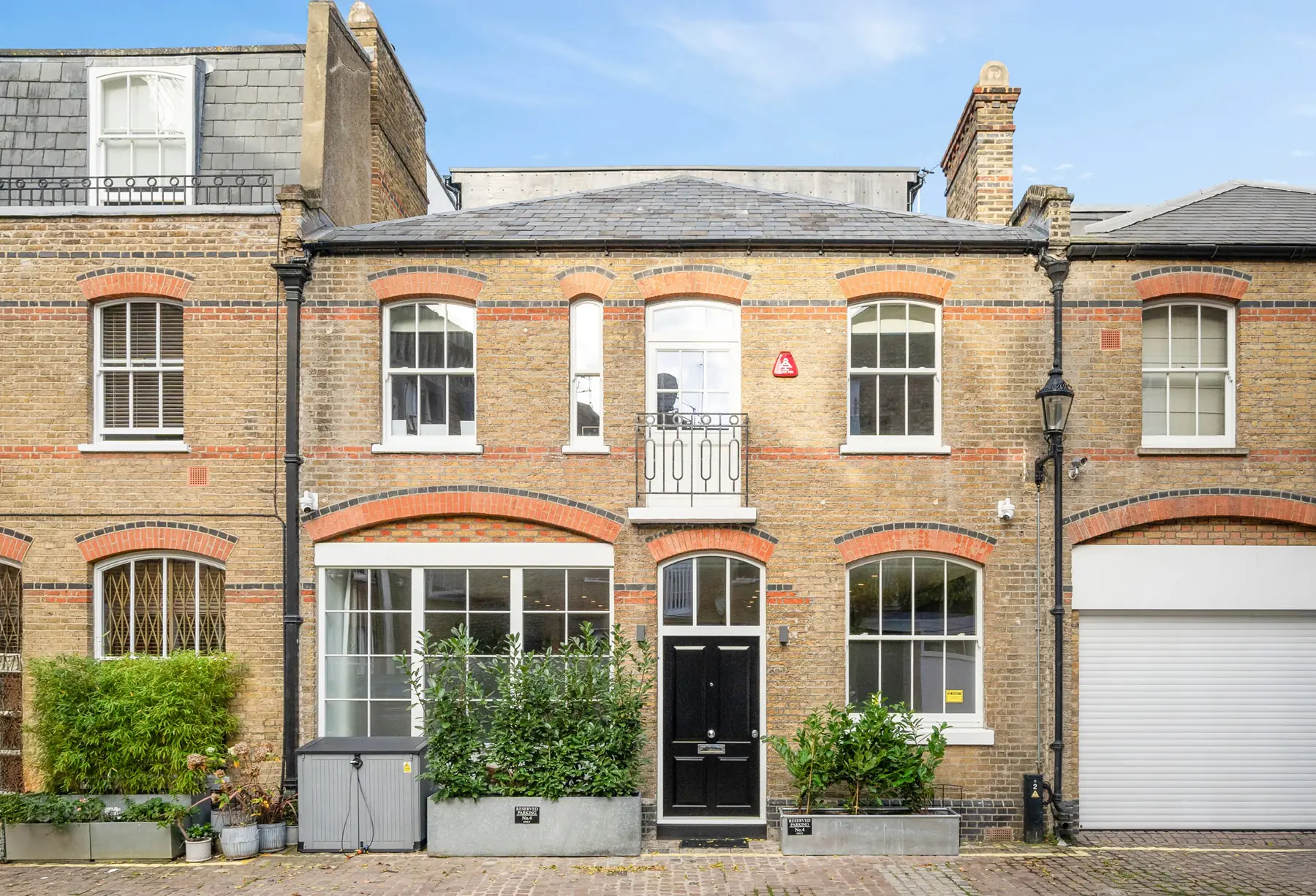 Brick mews house front after renovation