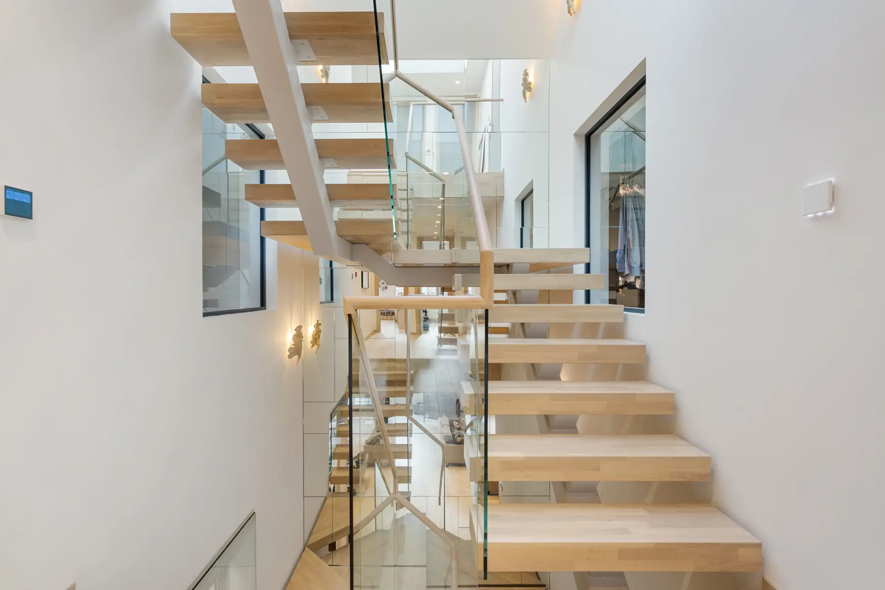Oak staircase rising through the house