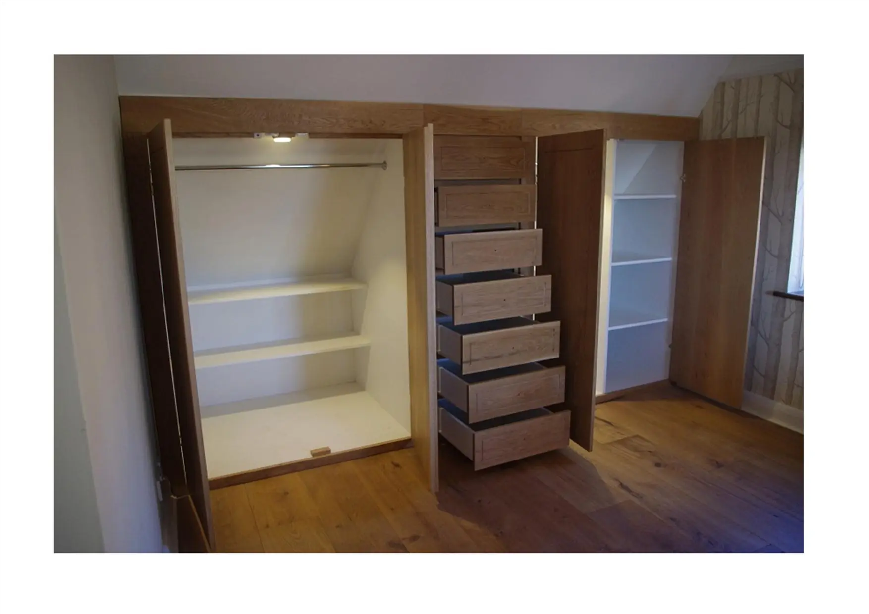 Inside the bespoke fitted wardrobe