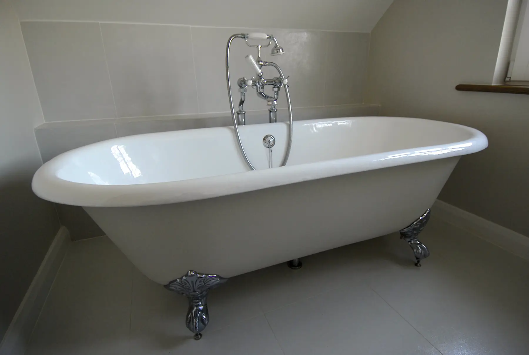 Loft bathroom with roll-top bath