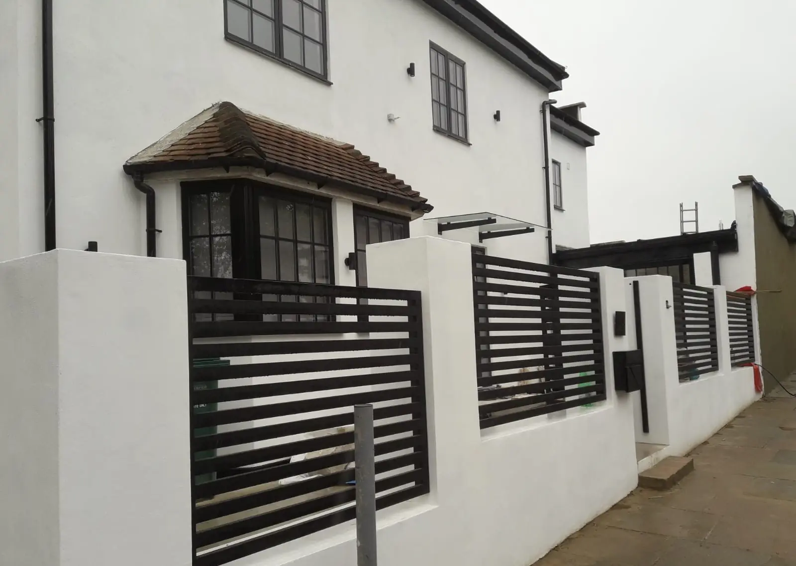 Rendered front of the house with new boundary railings