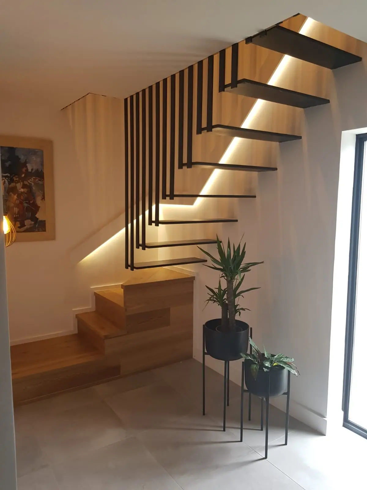 New staircase with steel balustrade and lighting