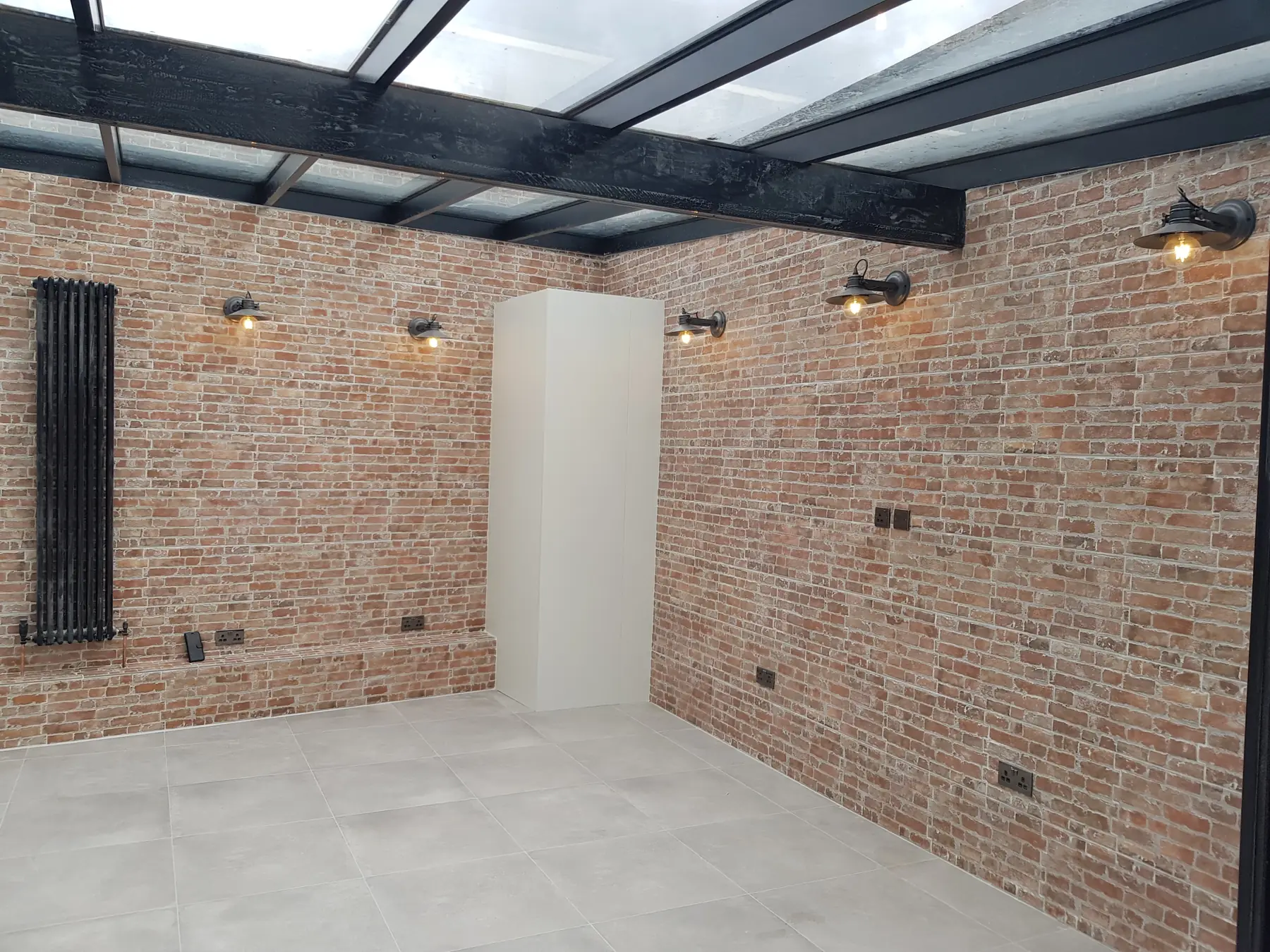 Rear room with exposed brick and steel